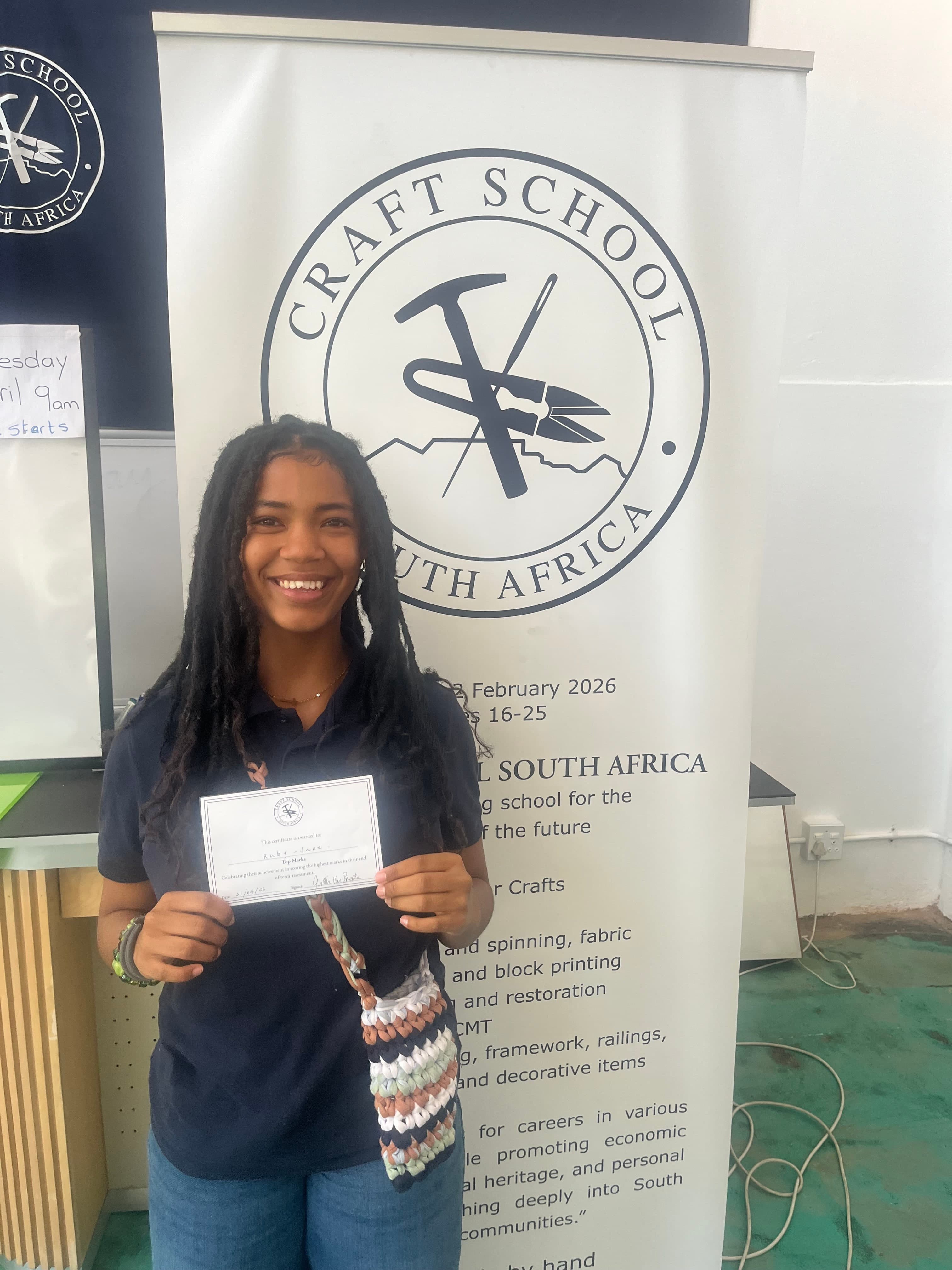 A Craft School student with her Term 1 certificate